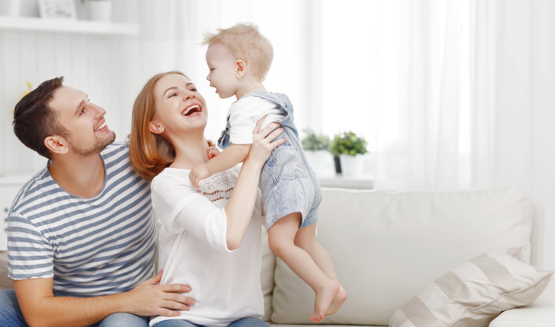 a family sitting on a couch